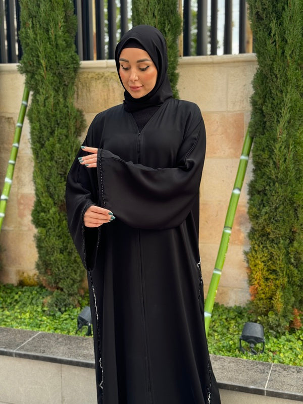 
                  
                    Black Abaya with Emirati Bead Elegance
                  
                