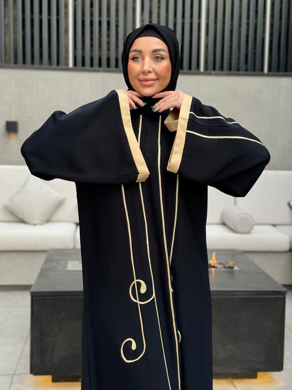 
                  
                    Stylish Black Abaya with Modern Details
                  
                