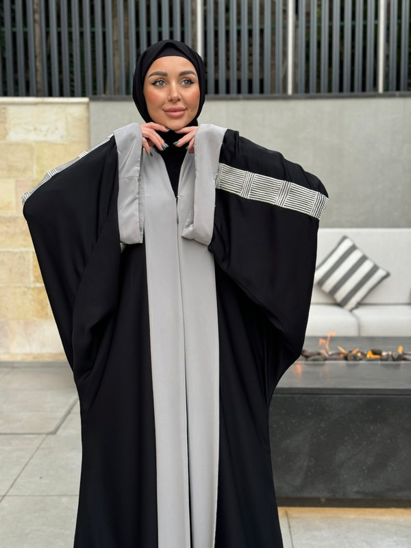
                  
                    Modern Black Abaya with Embroidered Detailing
                  
                
