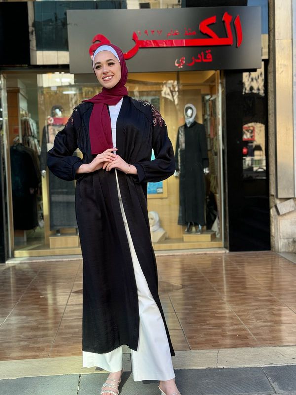 
                  
                    Black Abaya with Chic Embroidery
                  
                