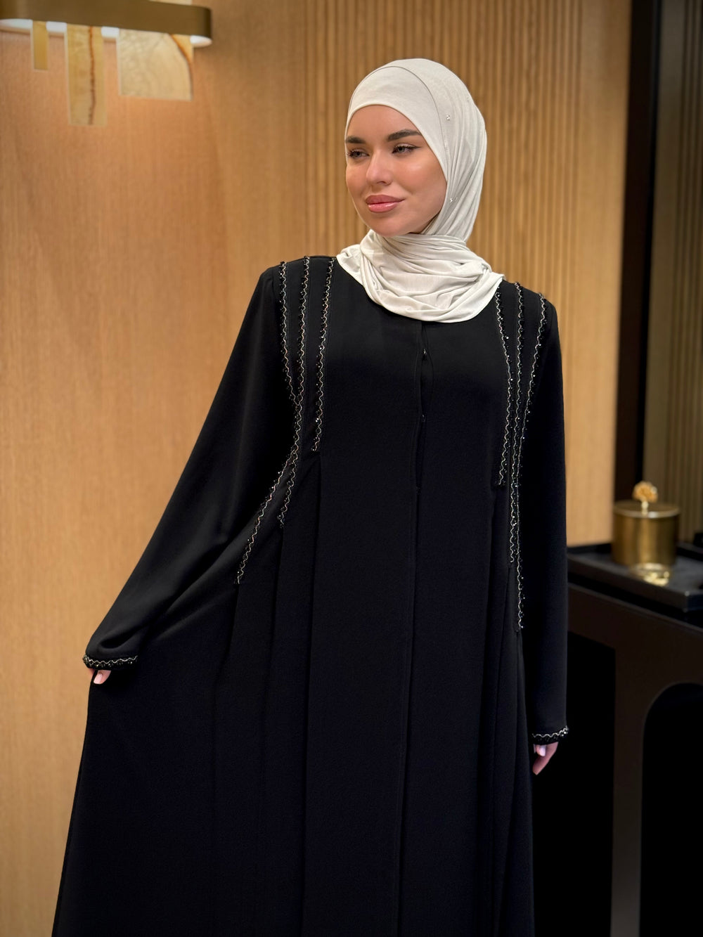 An elegant black abaya with beads