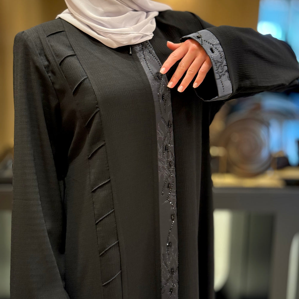 
                      
                        Unique Abaya With Beaded Details
                      
                    