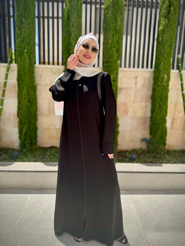 
                      
                        Elegant and Practical Black Abaya
                      
                    