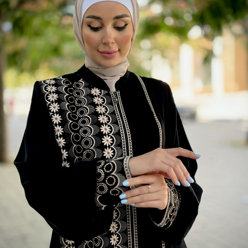 
                      
                        Black abaya with modern embroidery
                      
                    